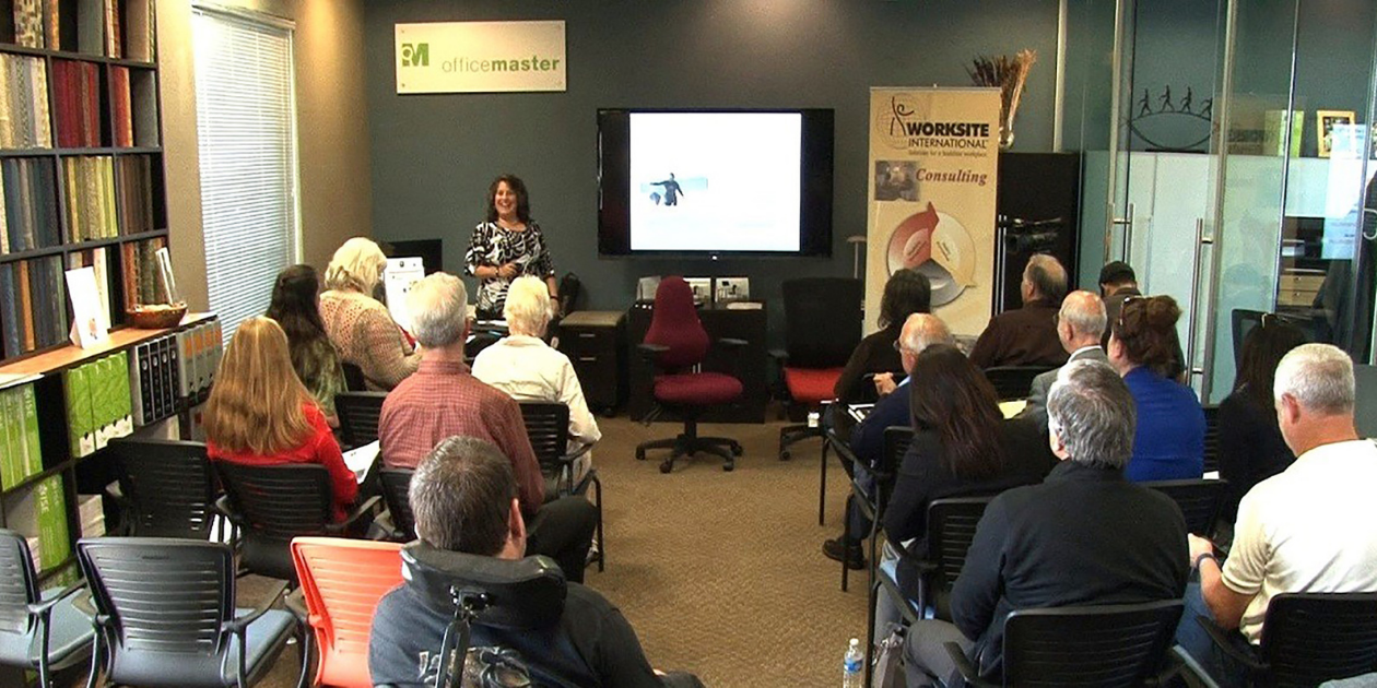 Alison presenting to an audience